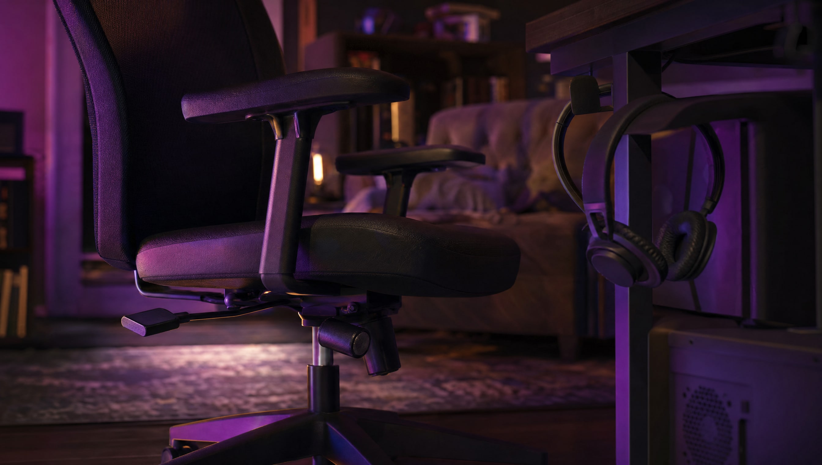 The adjustment levers under a chair seat, one paddle pulled out.