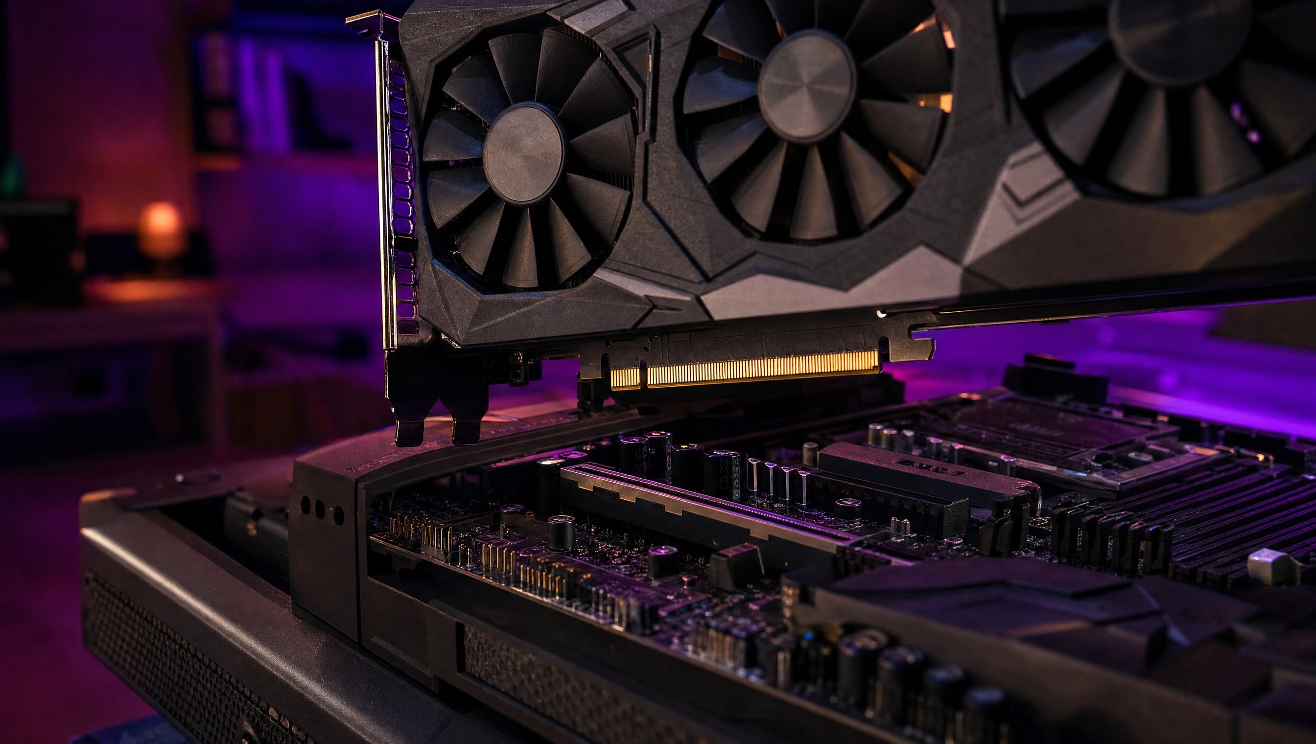 A graphics card being lowered into the top expansion slot of a motherboard.