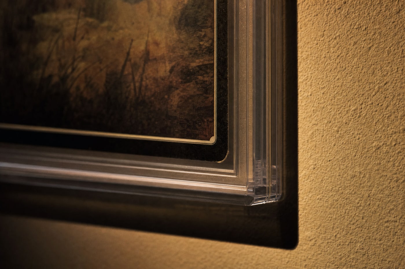 A close view of a slab corner against a matt wall, its shadow falling sharp beneath it.